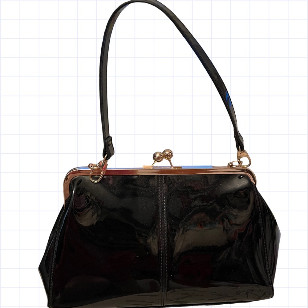 Black patent leather kiss lock handbag